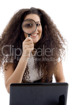 latin american female holding magnifier