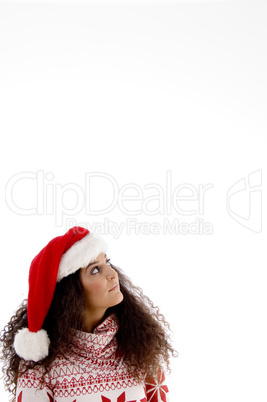 young female with christmas hat looking upward