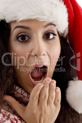 surprised young female with christmas hat