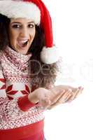 young female with christmas hat and open palm