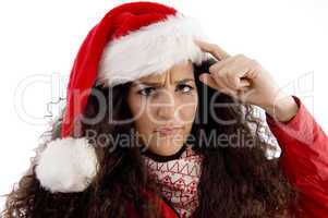 thinking young woman with christmas hat