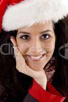 close up of smiling young woman with christmas hat