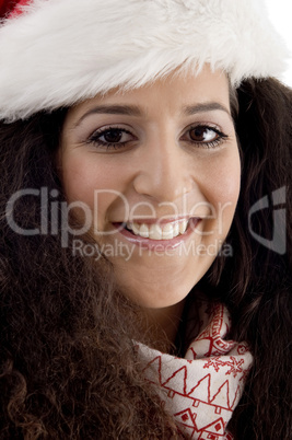 close up of young woman wearing christmas hat