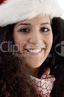 close up of young woman wearing christmas hat