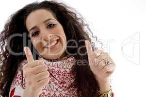 young woman showing thumb up with both hands