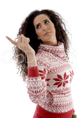 young woman pointing aside