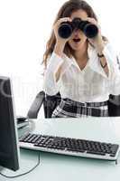 woman in office and looking through binocular