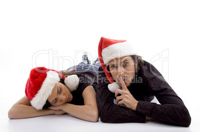 cute girl sleeping and guy indicating for silent