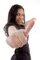 smiling young woman showing thumb up