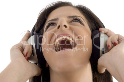 young woman listening music in headset