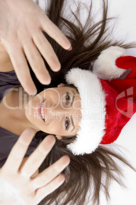 attractive woman lying on floor and showing open palms