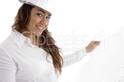 young female architect holding open blue prints