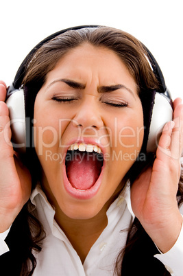 young woman listening to music and singing also