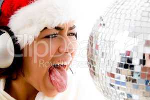 girl wearing christmas hat and teasing with tongue