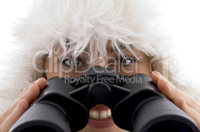 close up view of woman holding binocular