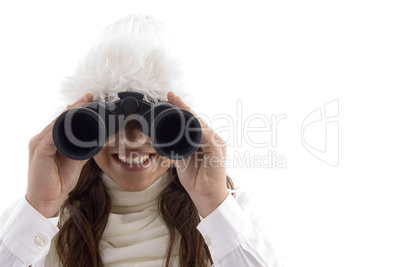 woman in winter wear watching through binocular