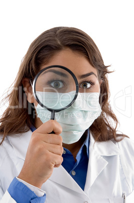 female doctor inspecting with magnifying glass