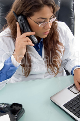 female doctor talking on cell phone