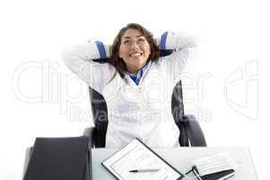cheerful female doctor looking upward