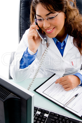 smiling doctor talking on phone