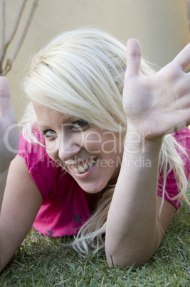 woman lying on green grass