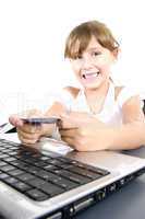 smiling girl with laptop and credit card