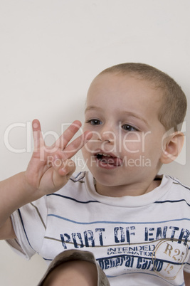 adorable child looking his fingers