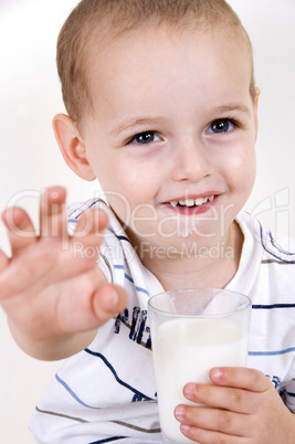 smiling boy with milk glass