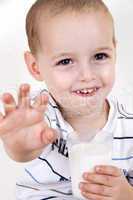 smiling boy with milk glass