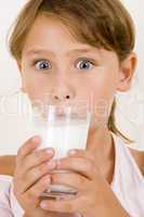 cute little girl drinking milk