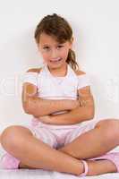 smiling girl with crossed arms