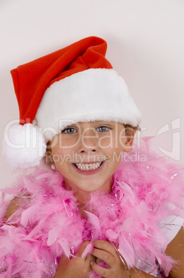 smiling cute girl with christmas hat on her head