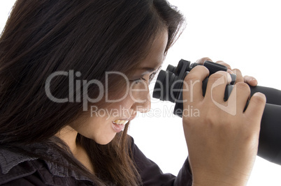 female looking through binocular