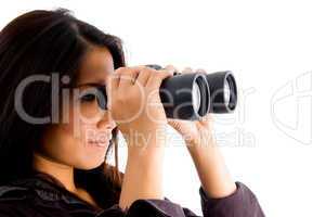 beautiful female watching through binocular