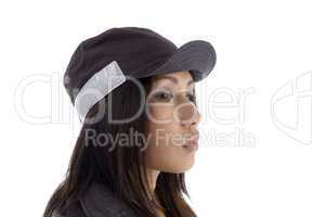 side pose of female wearing security cap