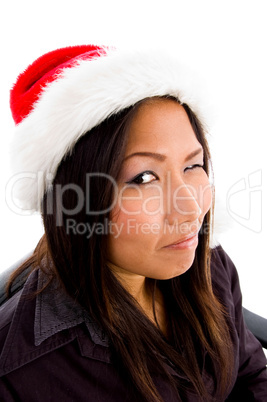 young female in christmas hat winking