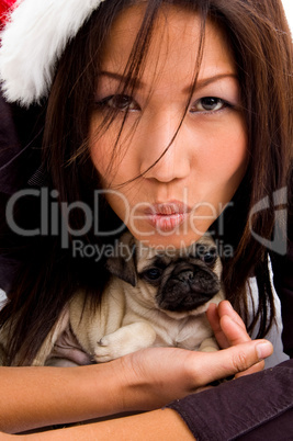beautiful woman holding cute puppy
