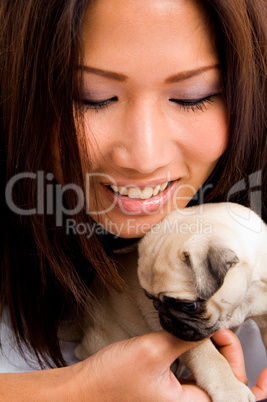 pretty female busy with puppy