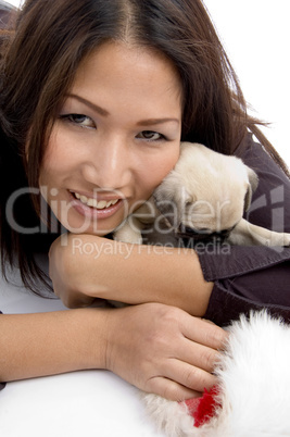 smiling female with christmas hat and puppy