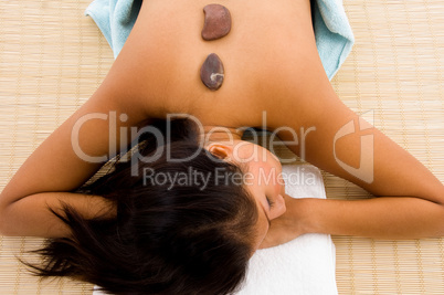 cute woman getting stone massage