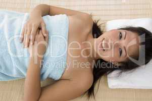 high angle view of smiling woman going to take massage