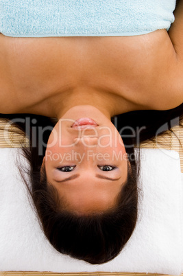 high angle view of laying woman looking at camera