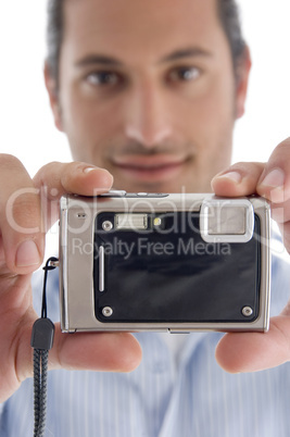 young caucasian man with camera