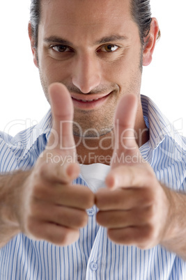 smiling handsome guy showing thumbs up