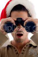 handsome guy looking into binoculars and surprised