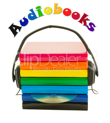 Stack of books and headphones - Audiobooks concept