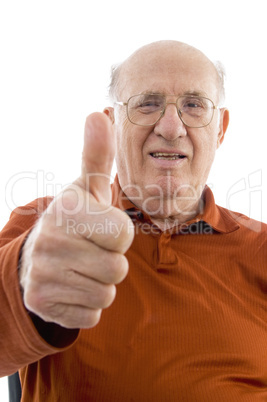 portrait of old man showing thumb up