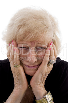 portrait of old woman holding her face
