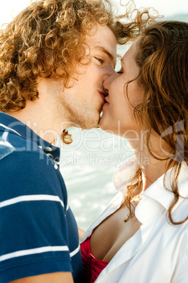 Couple kissing on the beach