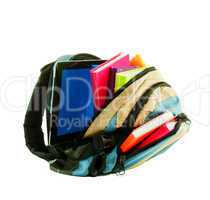 Backpack with colorful books and tablet PC against white backgro